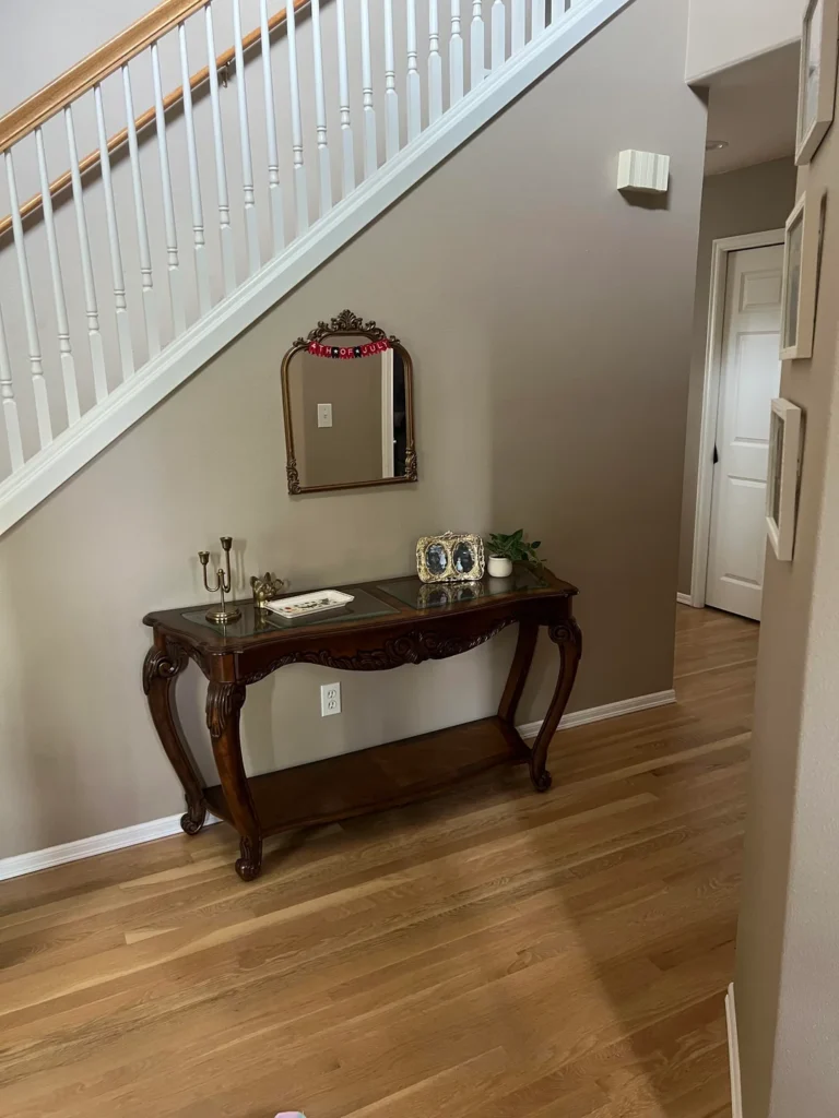 Use the wall above the table to support the table not compete with it