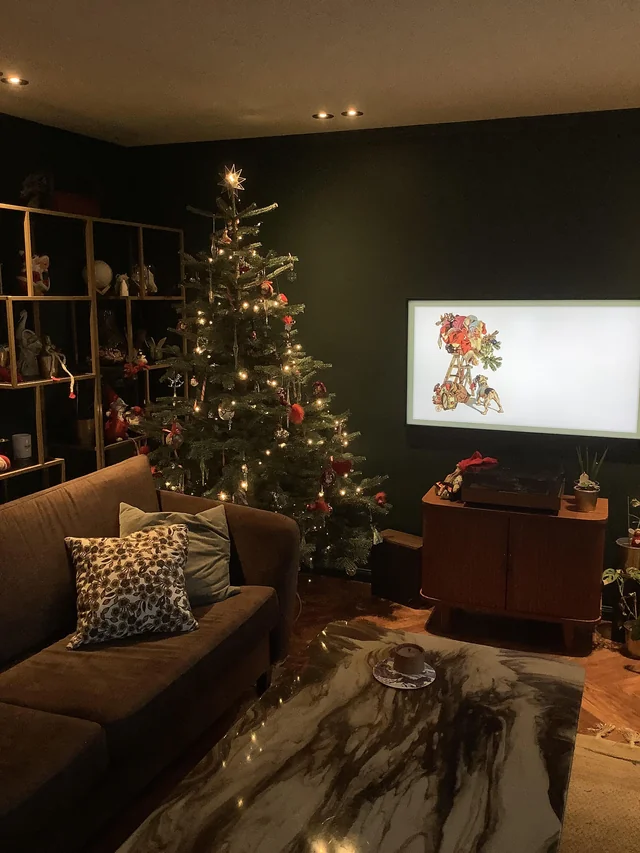 dark living room black walls warm lighting
