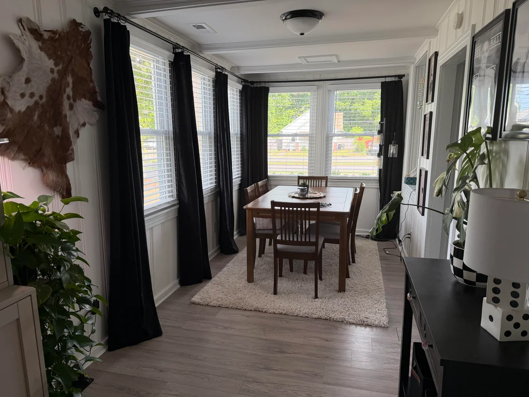 black drapes cozy living room daylight
