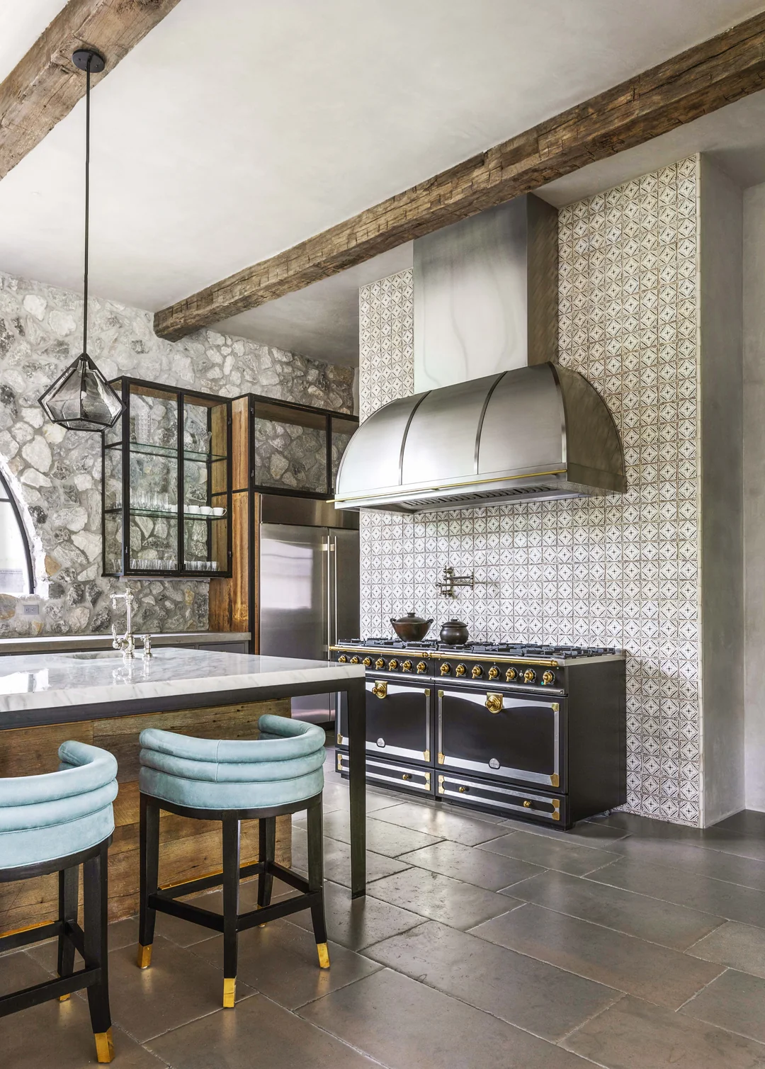 stone wall kitchen with metal lighting
