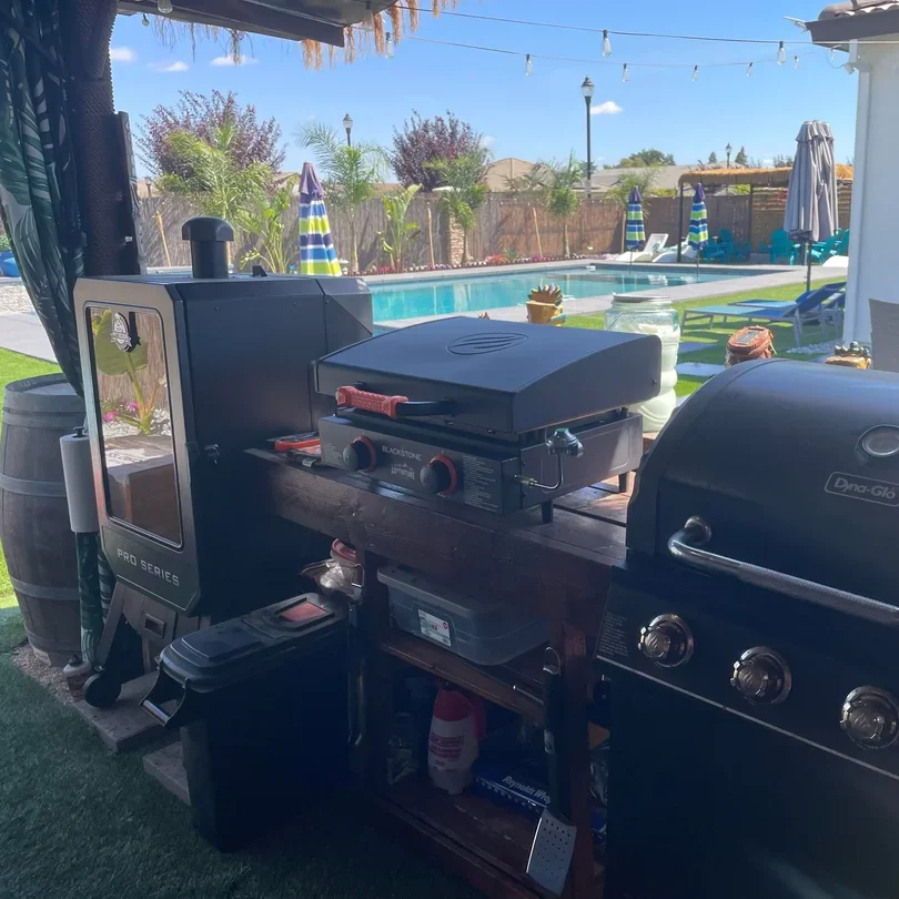 outdoor bar next to grill backyard

