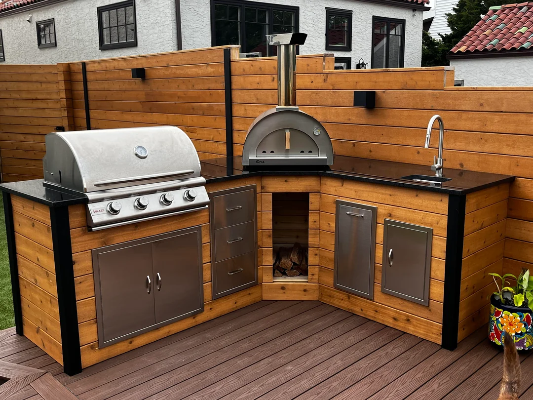 full outdoor kitchen with sink and grill

