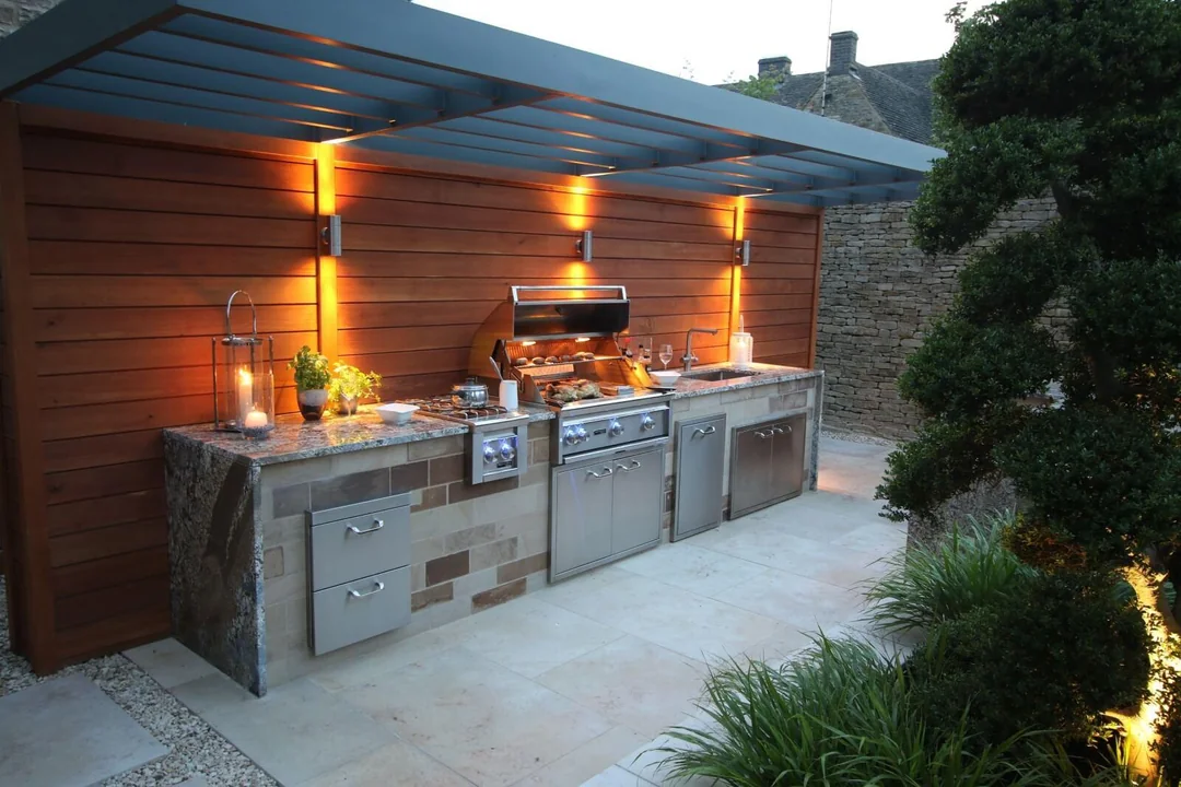 stone and wood outdoor grill area design
