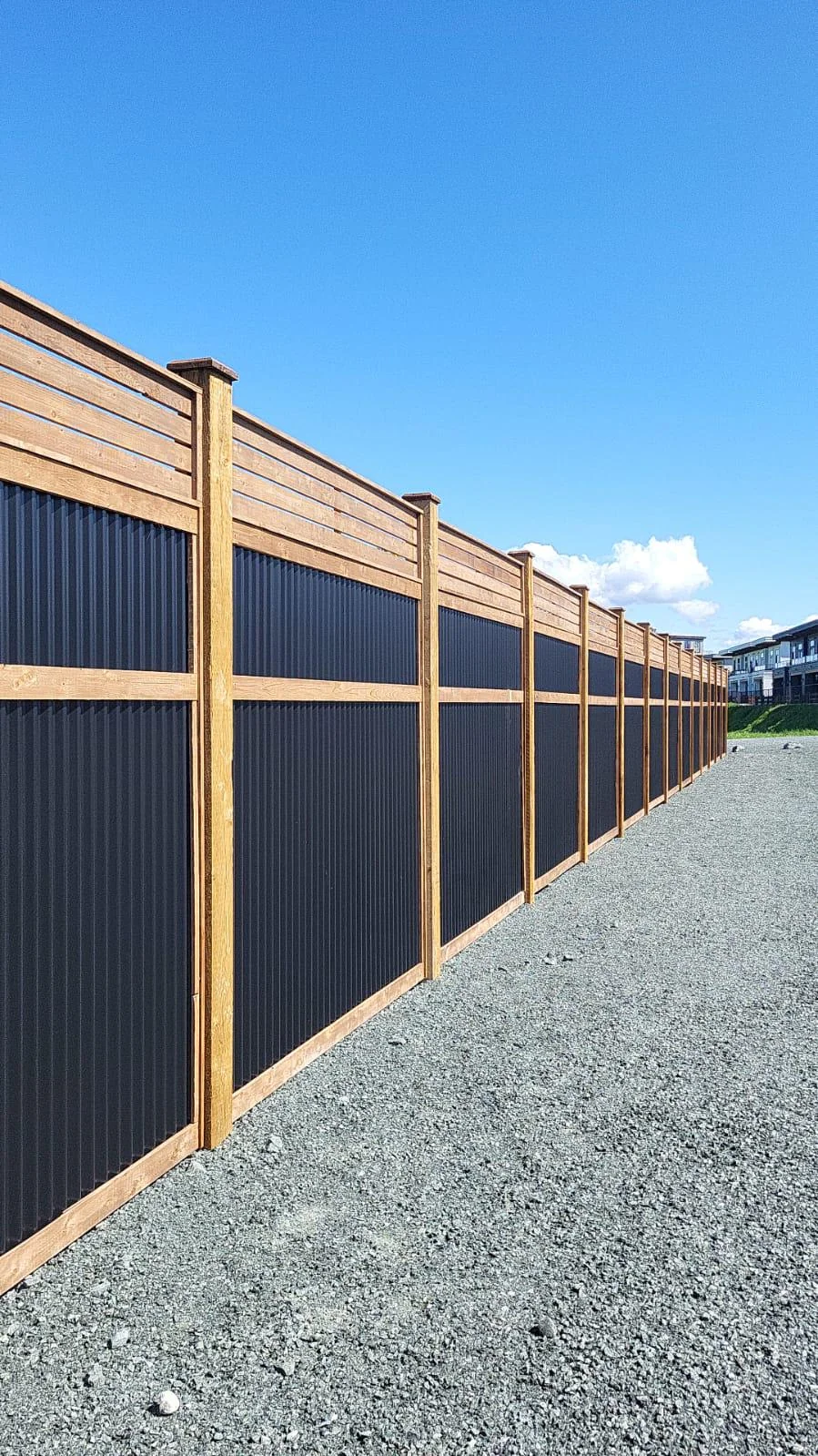 mixed material privacy fence wood metal backyard
