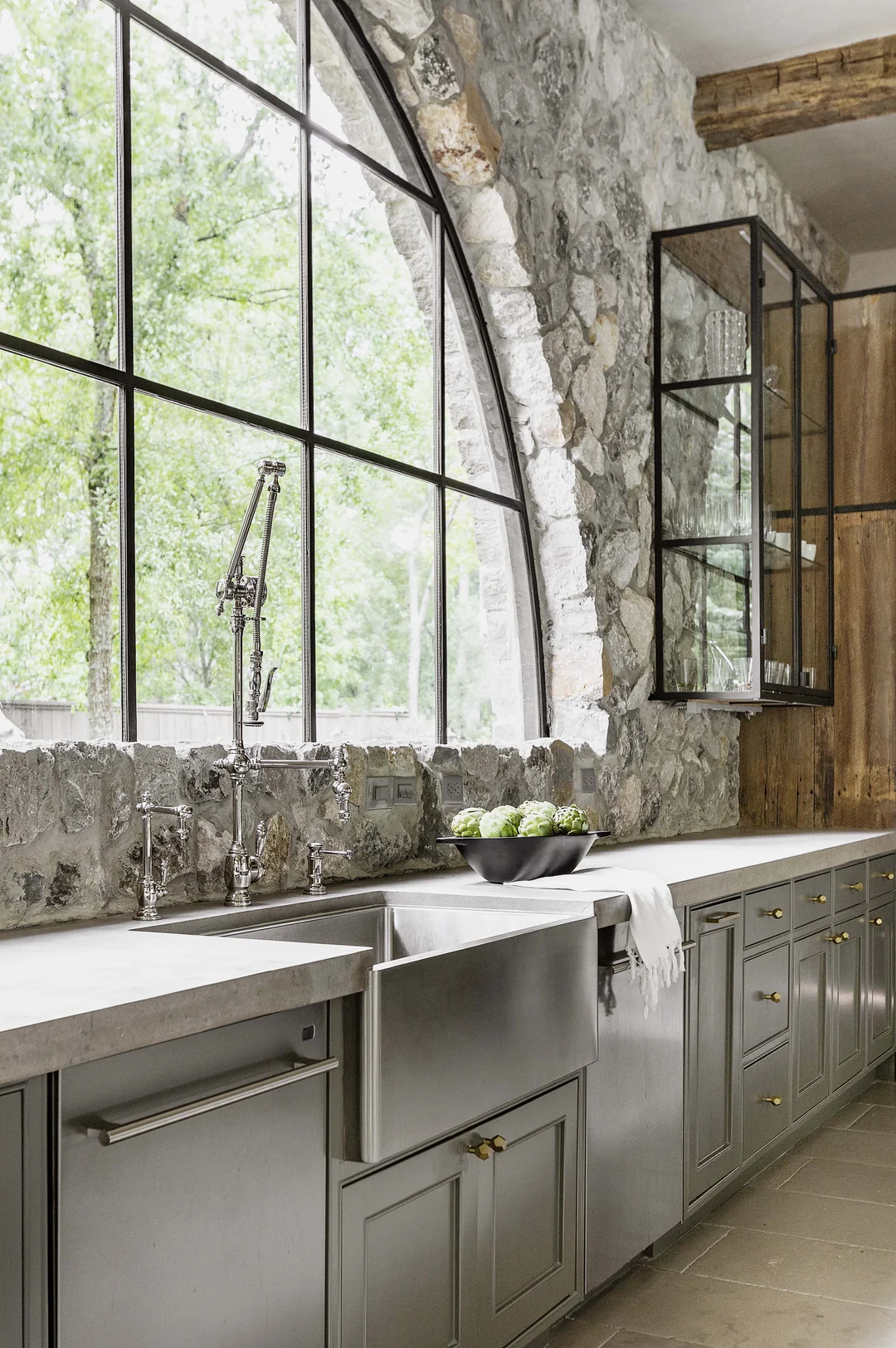 white kitchen with stone accent wall
