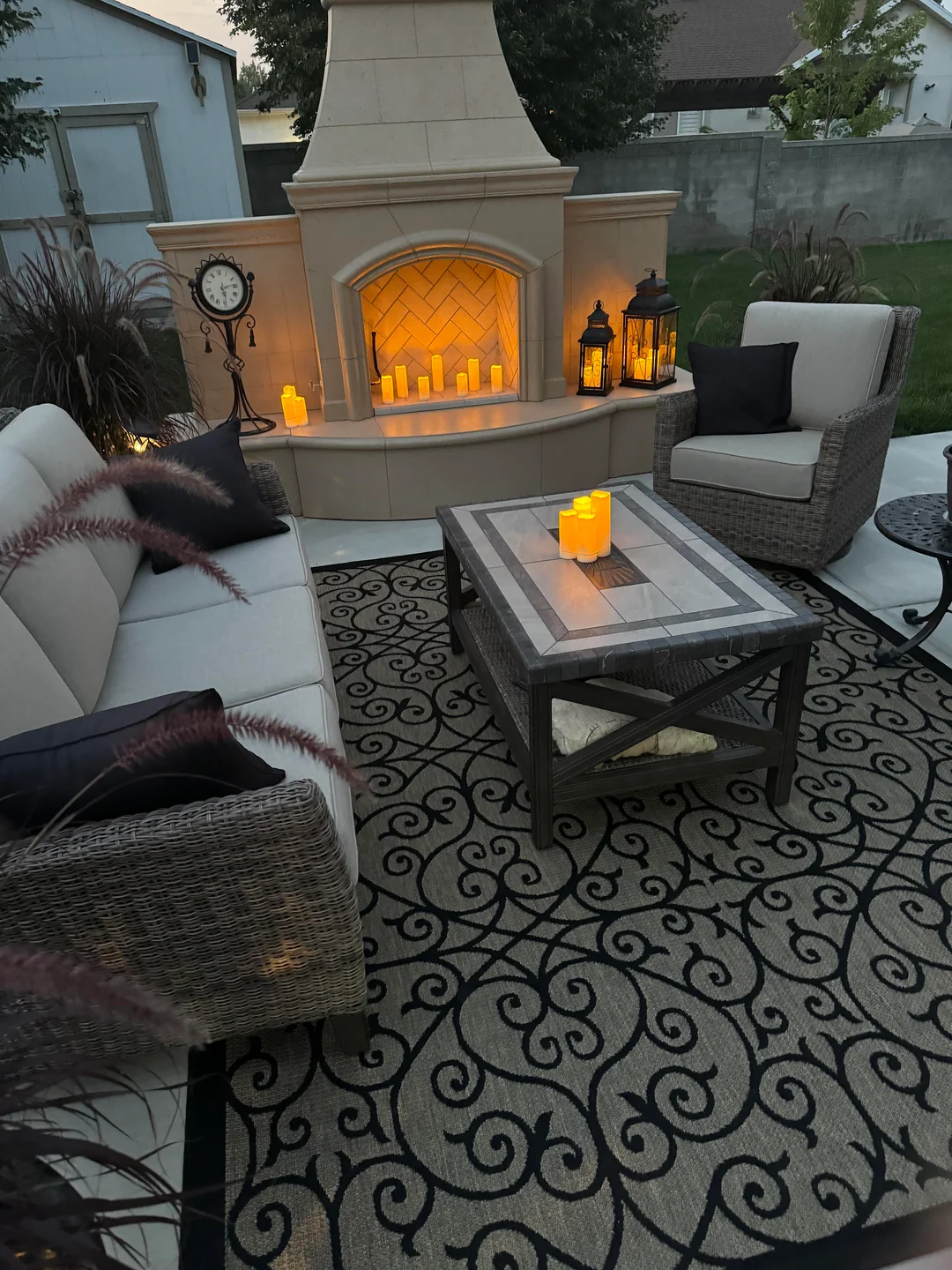 outdoor fireplace patio living room seating area
