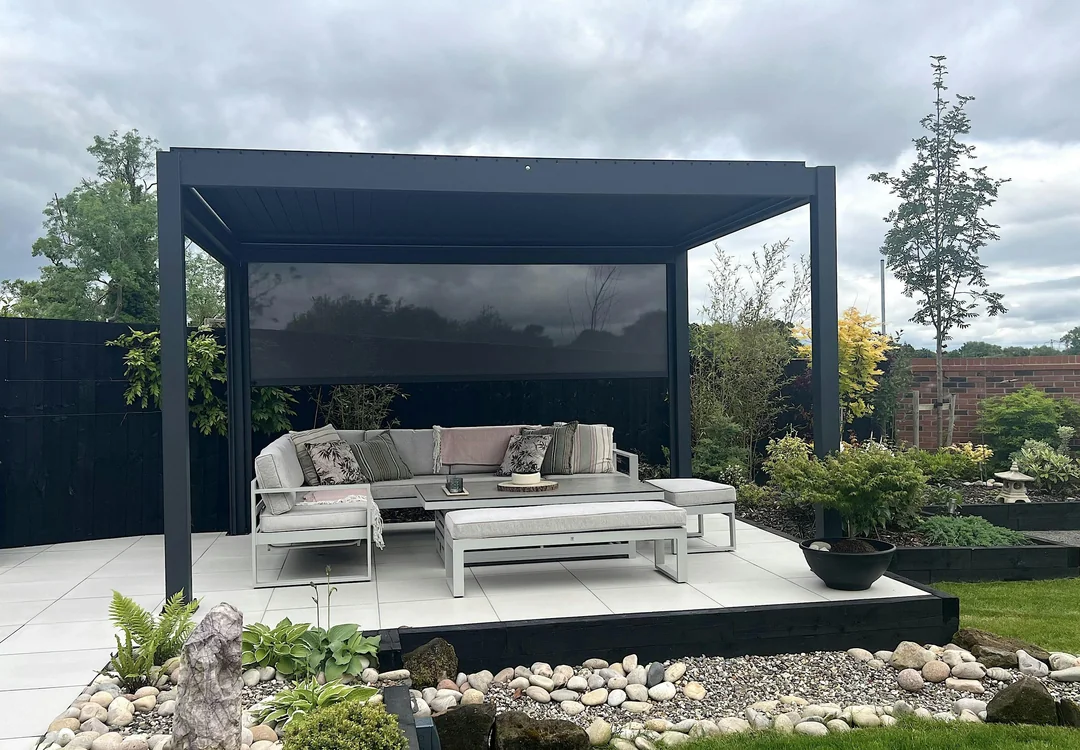 backyard bbq with plants under pergola
