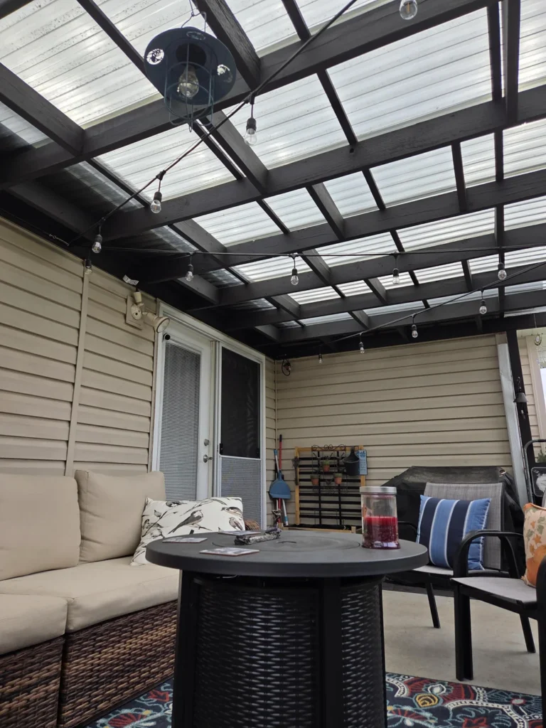 outdoor lounge under roof near grill
