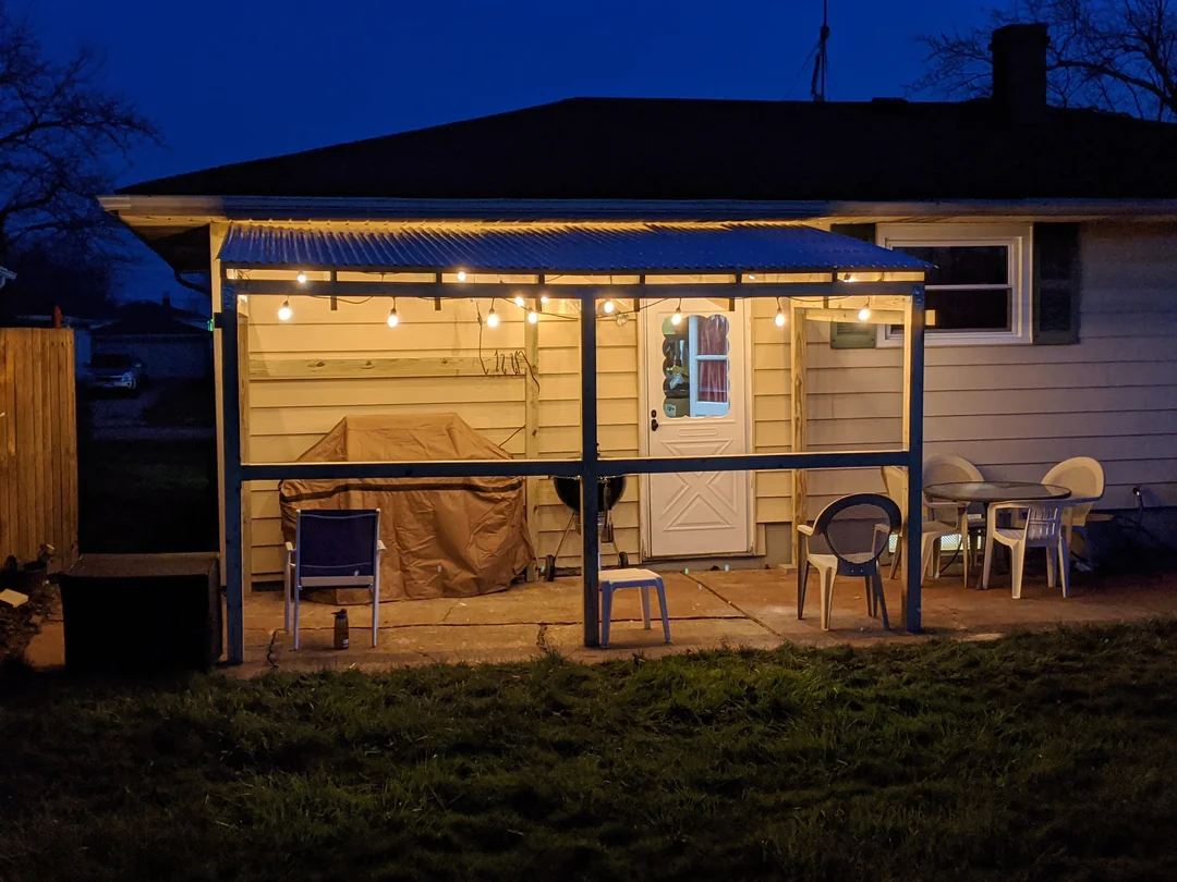 covered bbq lighting night backyard
