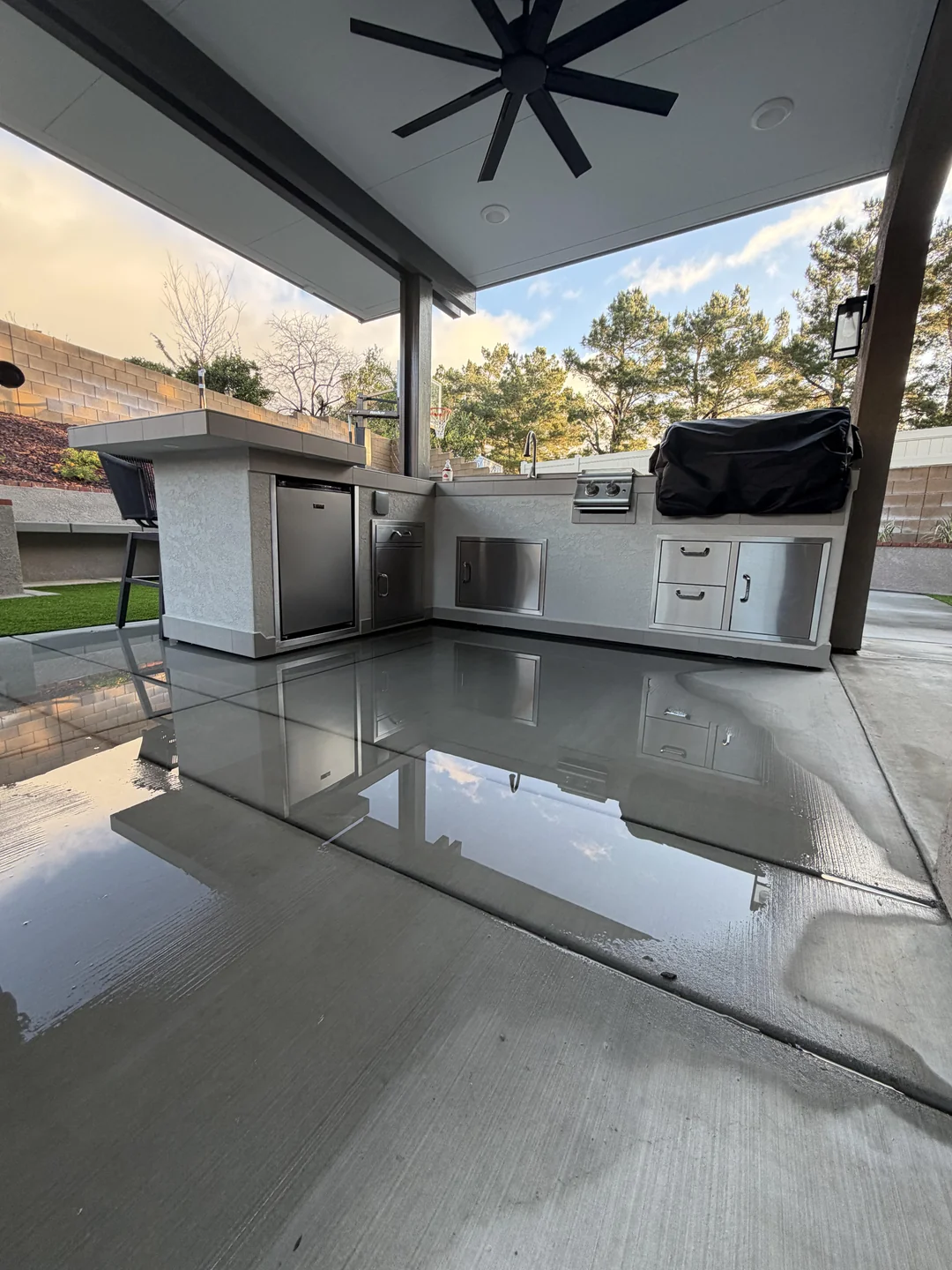 covered backyard grill setup rain
