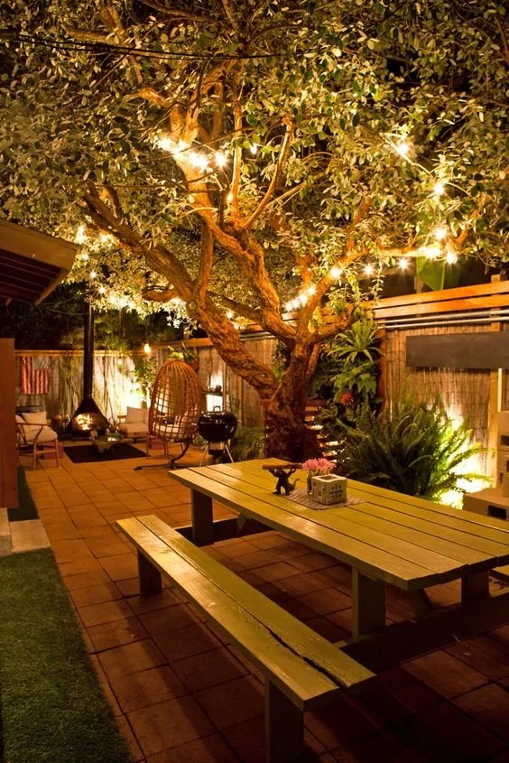 bbq area string lights backyard night
